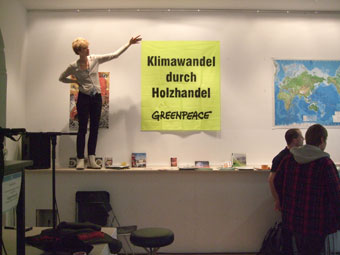 Johanna presenting Greenpaece poster
